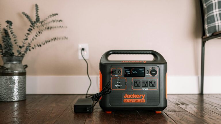 Portable power station plugged into a wall outlet at home