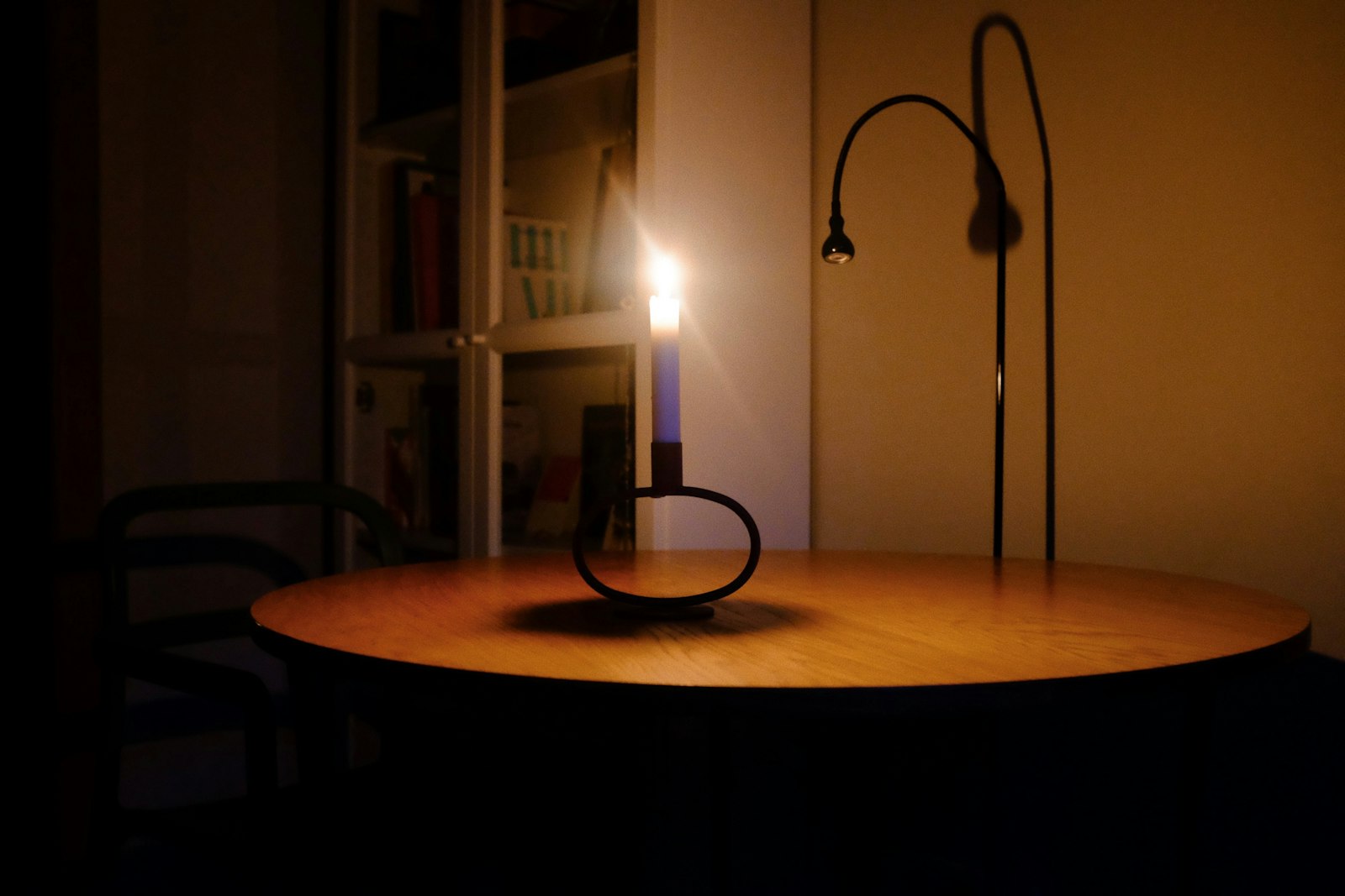 A candle on a table during a power outage